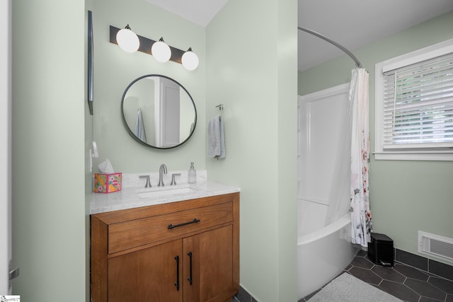 bathroom with visible vents, shower / tub combo, tile patterned flooring, and vanity