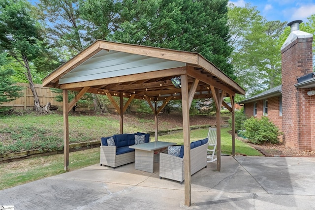view of patio with fence and an outdoor living space