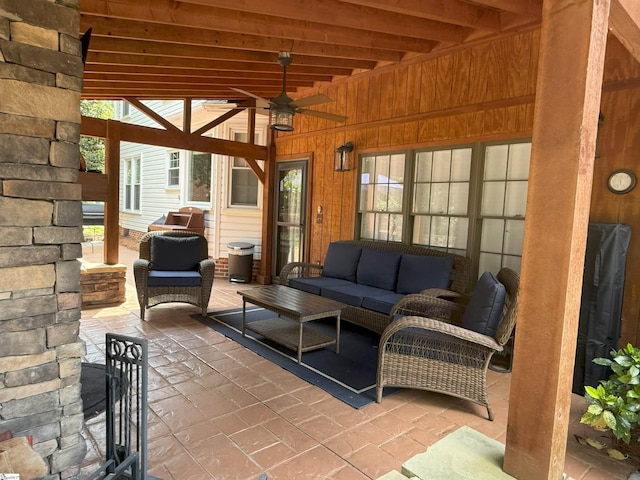 view of patio with outdoor lounge area and a ceiling fan