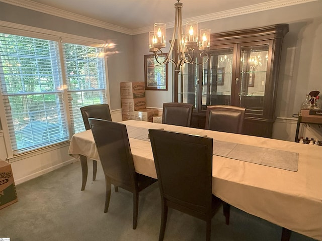 carpeted dining room with a notable chandelier and crown molding