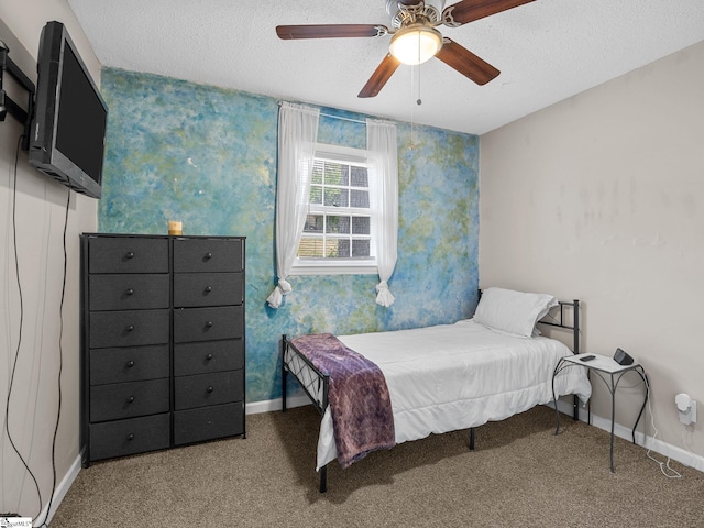 carpeted bedroom with a textured ceiling, a ceiling fan, wallpapered walls, and baseboards