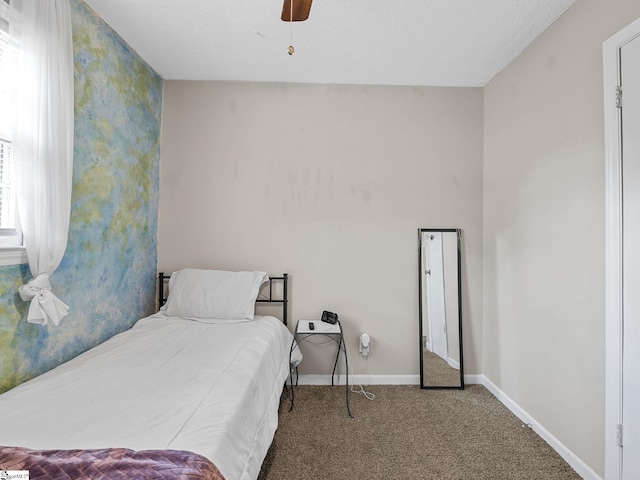 bedroom with baseboards, a ceiling fan, and carpet floors