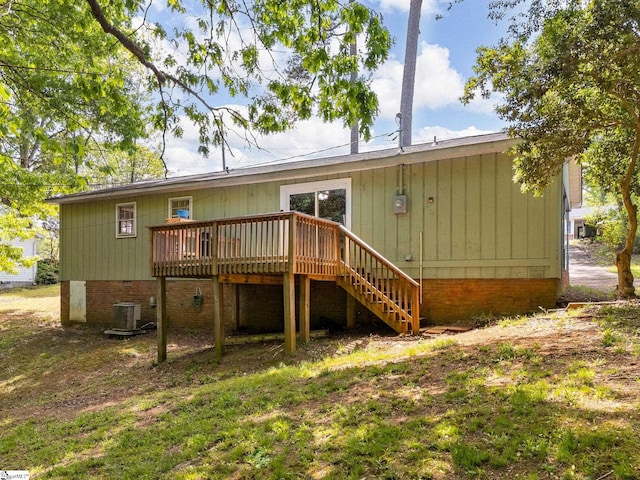 rear view of house featuring stairway, cooling unit, crawl space, and a wooden deck