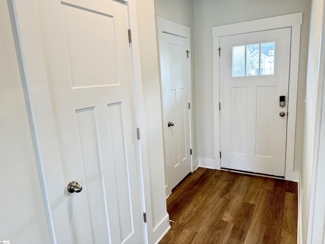 entryway with baseboards and dark wood finished floors