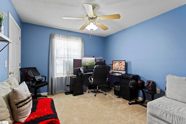 office with a textured ceiling, ceiling fan, and carpet floors