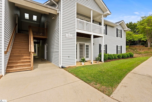 exterior space with driveway and stairway