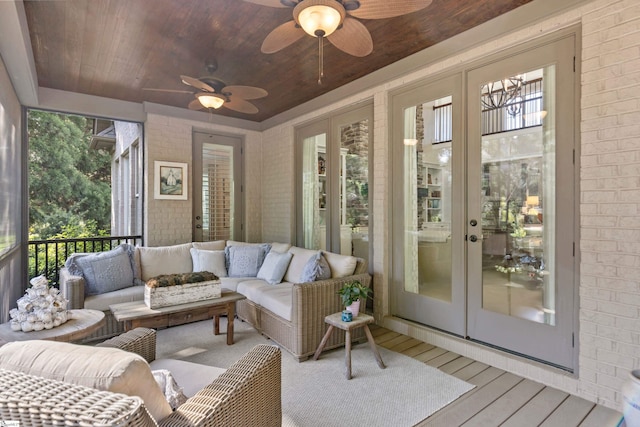 sunroom with an outdoor living space, a healthy amount of sunlight, french doors, and a ceiling fan