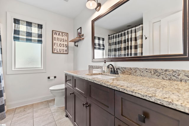 bathroom with tile patterned flooring, a shower with curtain, toilet, vanity, and baseboards