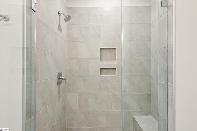 full bathroom featuring a shower stall