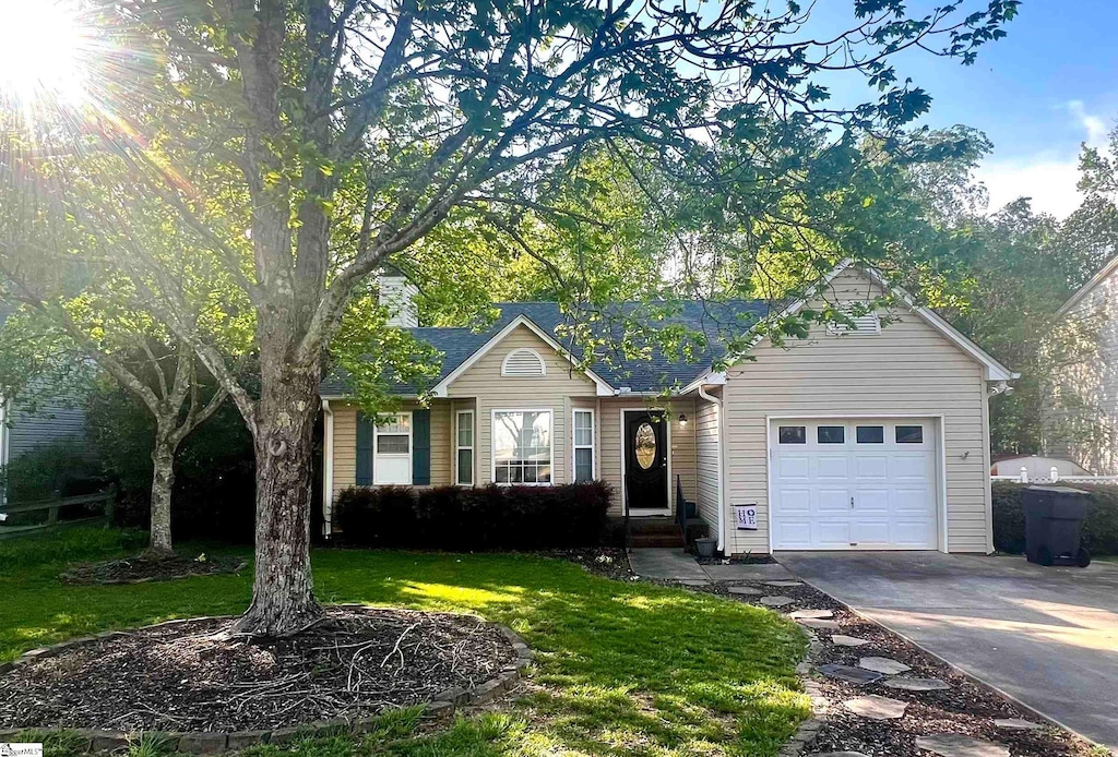 317 Riverside Chase Cir, Greer, SC 29650 - ranch-style home featuring concrete driveway, a front yard, and an attached garage