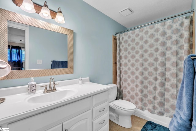 full bath featuring vanity, toilet, shower / tub combo, visible vents, and tile patterned flooring