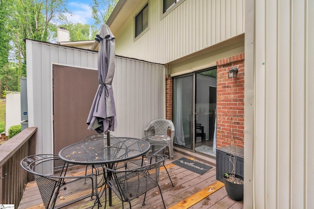 wooden deck featuring outdoor dining space