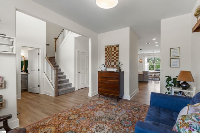 313 Glendon St, Greer, SC 29651 - living area with baseboards, recessed lighting, wood finished floors, and stairs