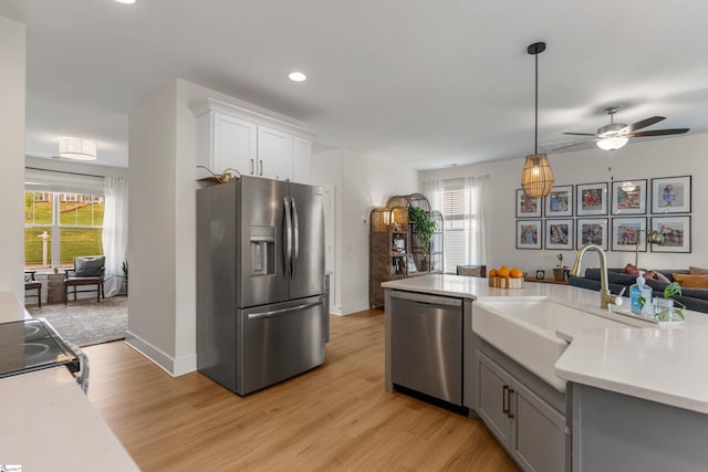 313 Glendon St, Greer, SC 29651 - kitchen with stainless steel appliances, ceiling fan, light countertops, and a sink