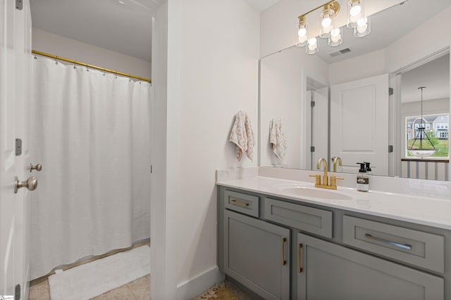 313 Glendon St, Greer, SC 29651 - bathroom with visible vents, a shower with shower curtain, baseboards, tile patterned floors, and vanity