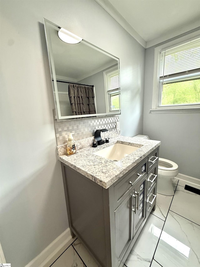 full bathroom with marble finish floor, decorative backsplash, and baseboards
