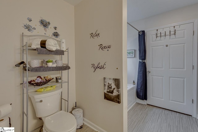 3 Heatherfield Dr, Simpsonville, SC 29680 - full bathroom featuring toilet, wood finished floors, shower / tub combo with curtain, and baseboards
