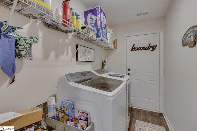3 Heatherfield Dr, Simpsonville, SC 29680 - washroom featuring wood finished floors, laundry area, independent washer and dryer, baseboards, and visible vents
