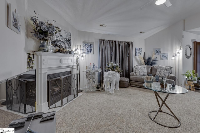 3 Heatherfield Dr, Simpsonville, SC 29680 - living room featuring carpet flooring, visible vents, a fireplace with flush hearth, and lofted ceiling