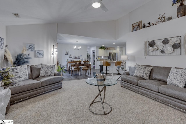 3 Heatherfield Dr, Simpsonville, SC 29680 - living area with visible vents, vaulted ceiling, wood finished floors, and ceiling fan with notable chandelier