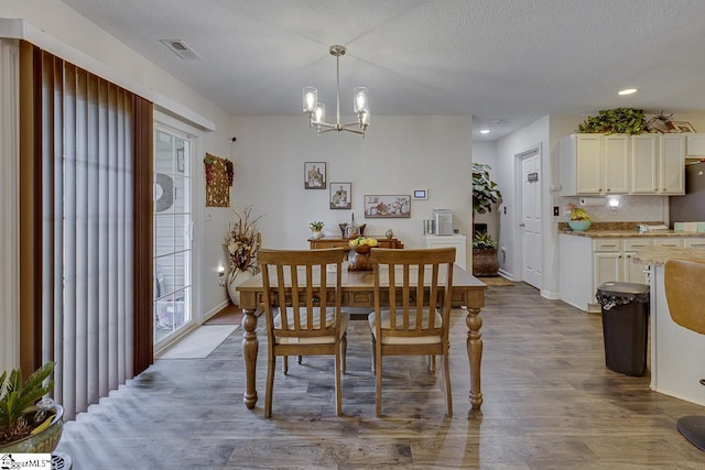3 Heatherfield Dr, Simpsonville, SC 29680 - dining area with recessed lighting, a chandelier, visible vents, a textured ceiling, and dark wood finished floors