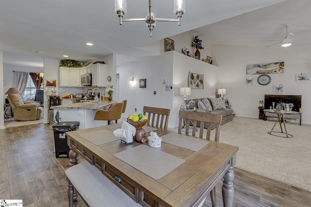 3 Heatherfield Dr, Simpsonville, SC 29680 - dining room with recessed lighting, wood finished floors, ceiling fan with notable chandelier, baseboards, and lofted ceiling