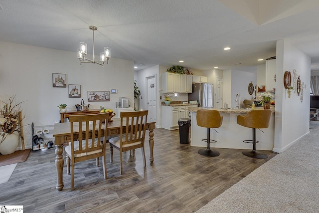 3 Heatherfield Dr, Simpsonville, SC 29680 - dining space with an inviting chandelier, a textured ceiling, recessed lighting, and dark wood-style floors