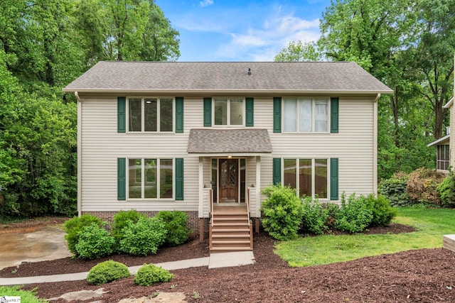 colonial-style house with a shingled roof