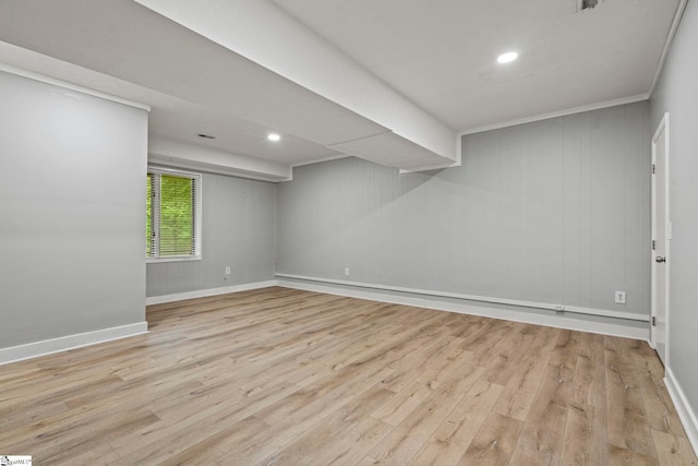 below grade area featuring recessed lighting, wood finished floors, and baseboards