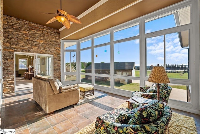 sunroom featuring tile patterned floors and a healthy amount of sunlight