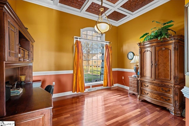 office area with coffered ceiling, baseboards, beam ceiling, ornamental molding, and wood finished floors