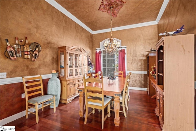 dining space featuring hardwood / wood-style floors, a chandelier, and crown molding