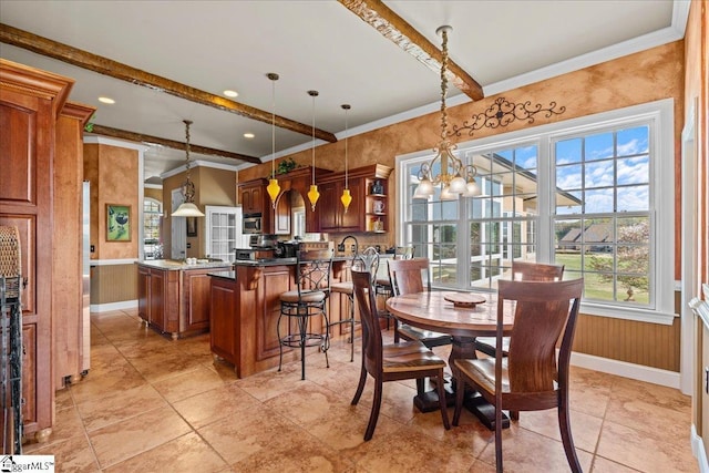 dining space with baseboards, beamed ceiling, and crown molding