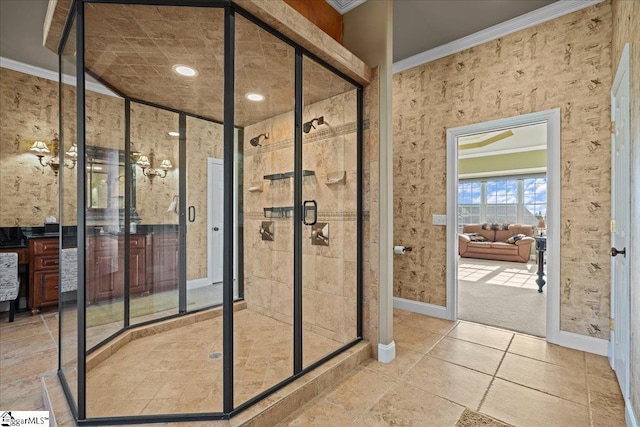 bathroom featuring baseboards, ornamental molding, and a shower stall
