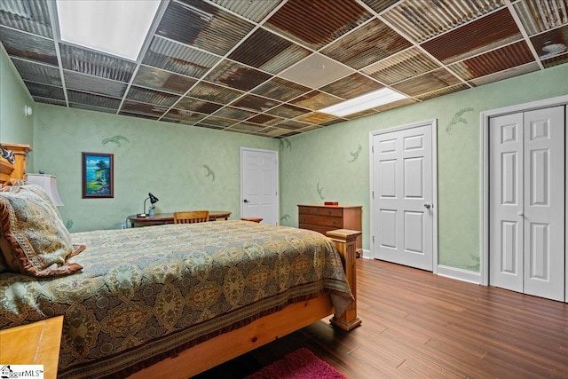bedroom with wood finished floors