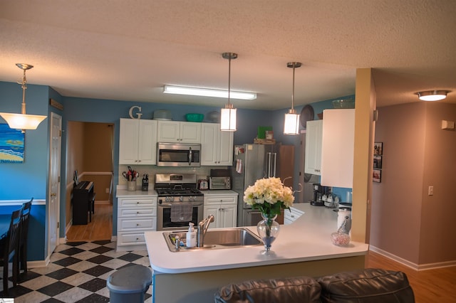 104 Fairview Lake Way, Simpsonville, SC 29680 - kitchen featuring tile patterned floors, a peninsula, stainless steel appliances, and white cabinetry