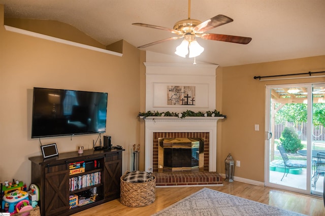 104 Fairview Lake Way, Simpsonville, SC 29680 - living area with wood finished floors, a fireplace, baseboards, a ceiling fan, and lofted ceiling