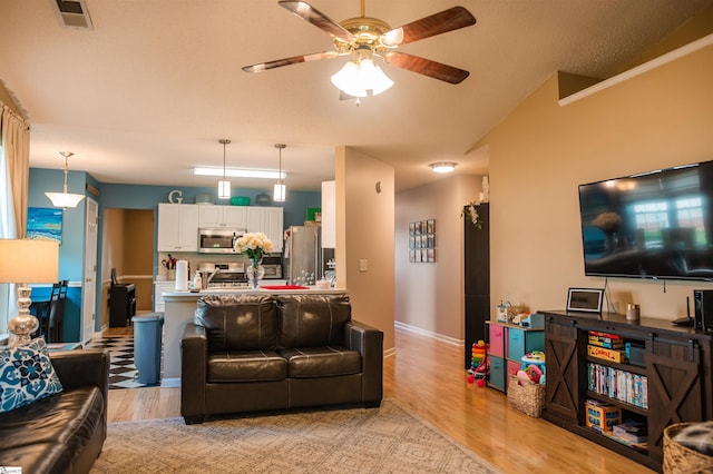 104 Fairview Lake Way, Simpsonville, SC 29680 - living room featuring baseboards, visible vents, ceiling fan, and light wood-style flooring
