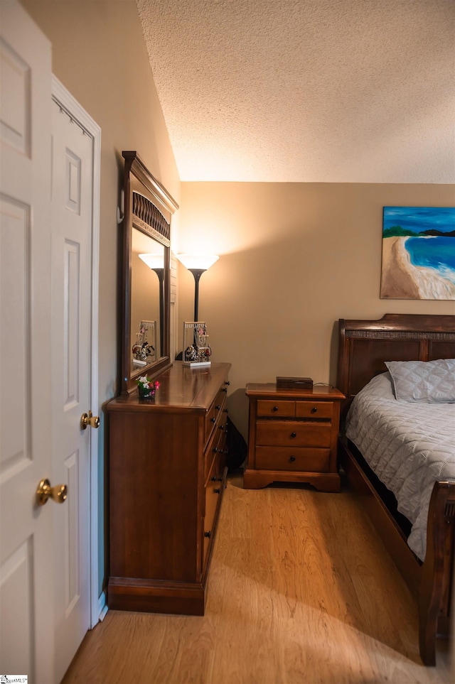 104 Fairview Lake Way, Simpsonville, SC 29680 - bedroom with a textured ceiling and light wood-style flooring