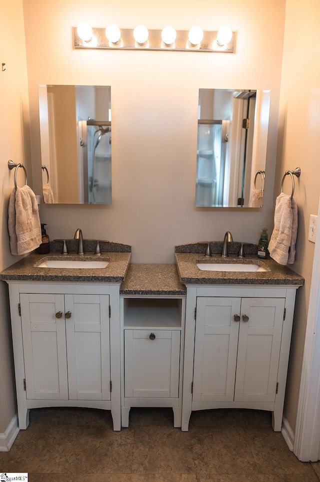 104 Fairview Lake Way, Simpsonville, SC 29680 - bathroom with two vanities, baseboards, and a sink
