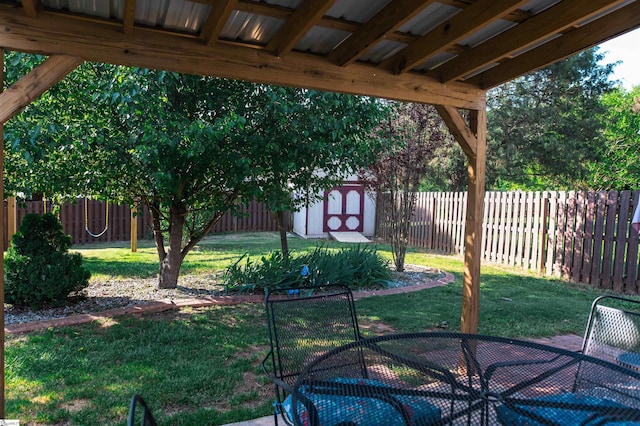 104 Fairview Lake Way, Simpsonville, SC 29680 - view of yard featuring a fenced backyard, outdoor dining area, a patio area, and an outdoor structure