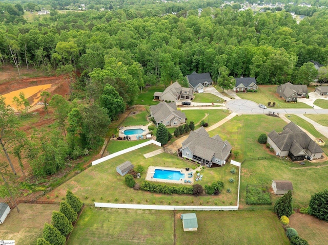 drone / aerial view with a view of trees