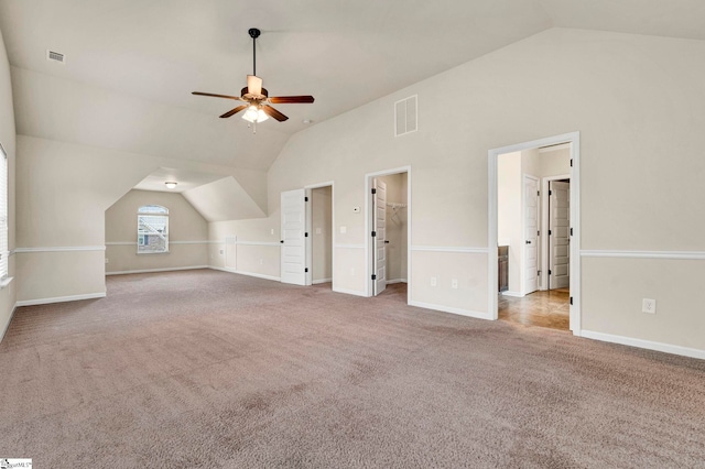bonus room with lofted ceiling, visible vents, a ceiling fan, and carpet floors