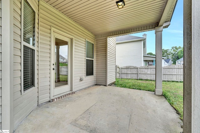view of patio / terrace featuring fence
