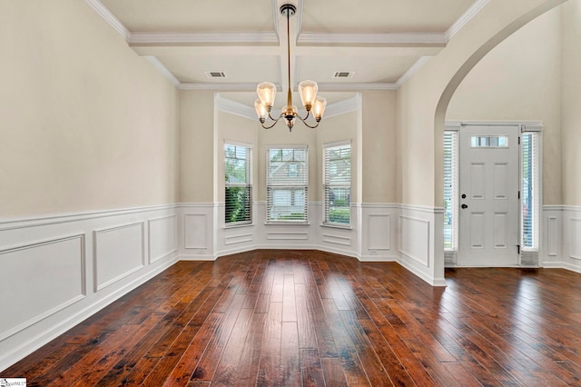 foyer with a notable chandelier, coffered ceiling, visible vents, arched walkways, and hardwood / wood-style floors