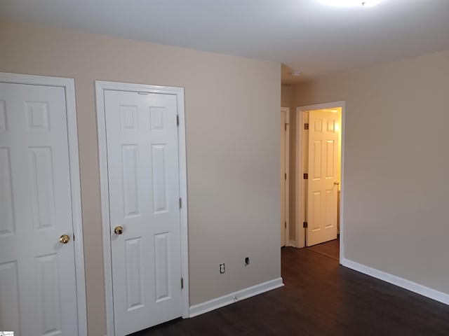 315 Farnsworth Rd, Spartanburg, SC 29301 - unfurnished bedroom with dark wood-style flooring and baseboards