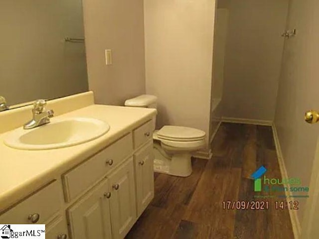 317 Farnsworth Rd, Spartanburg, SC 29301 - full bathroom with wood finished floors, toilet, and vanity