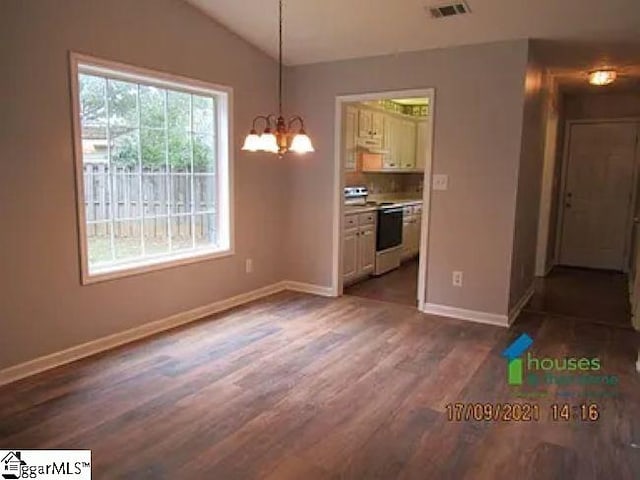 317 Farnsworth Rd, Spartanburg, SC 29301 - unfurnished dining area featuring dark wood-style flooring, baseboards, lofted ceiling, and a chandelier