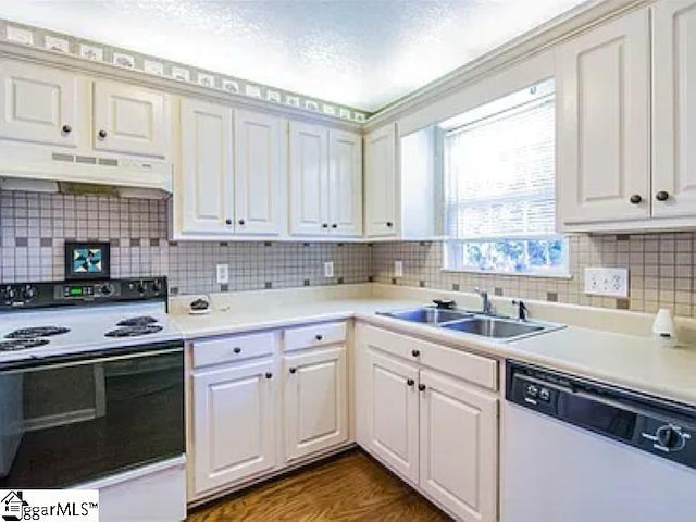 317 Farnsworth Rd, Spartanburg, SC 29301 - kitchen with electric range oven, dishwasher, under cabinet range hood, a sink, and backsplash