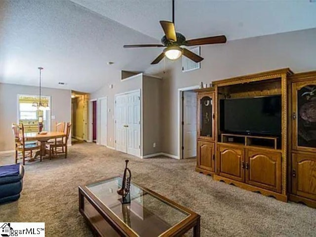 317 Farnsworth Rd, Spartanburg, SC 29301 - carpeted living area featuring a ceiling fan, vaulted ceiling, a chandelier, baseboards, and a textured ceiling